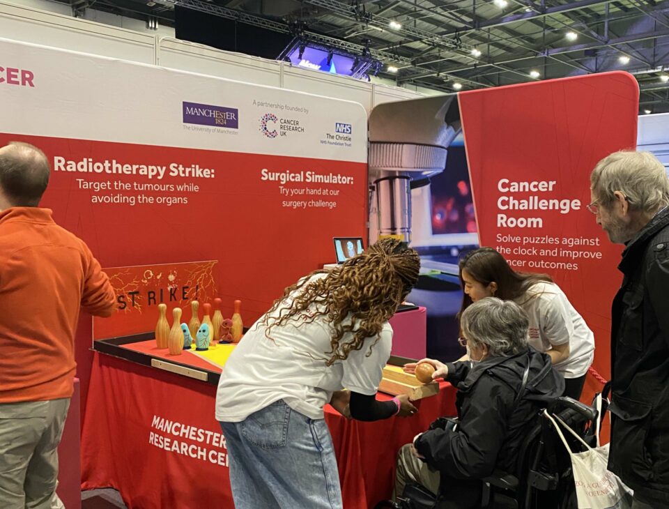Ambassadors talking to members of the public at the MCRC stand