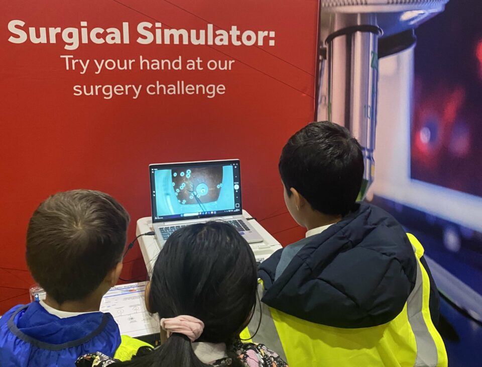 A group of school children taking part in our surgical simulator